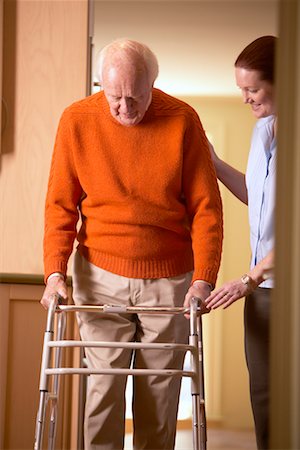 Woman Helping Man with Walker Stock Photo - Rights-Managed, Code: 700-00341063