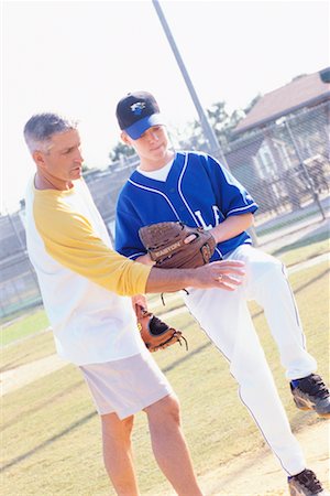 simsearch:700-00097991,k - Man Coaching Boy with Pitching Stock Photo - Rights-Managed, Code: 700-00342058
