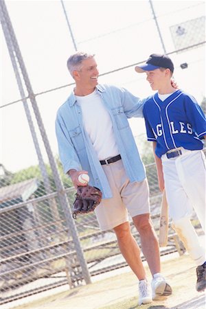 Father with Son on Baseball Diamond Foto de stock - Con derechos protegidos, Código: 700-00342050