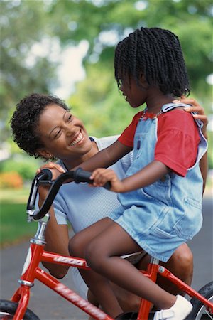 simsearch:700-03067843,k - Mother Helping Daughter Ride Bike Stock Photo - Rights-Managed, Code: 700-00356929