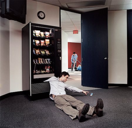 Man with his Arm Stuck in a Vending Machine Stock Photo - Rights-Managed, Code: 700-00356990