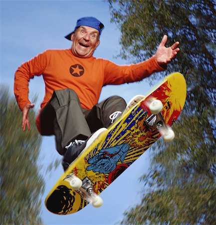 Senior Man Skateboarding Foto de stock - Con derechos protegidos, Código: 700-00357541