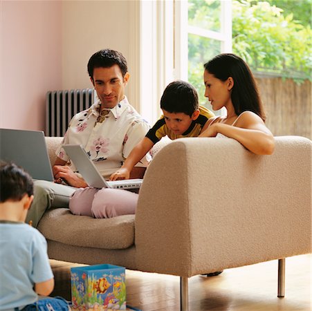 Family Relaxing in Living Room Stock Photo - Rights-Managed, Code: 700-00364263