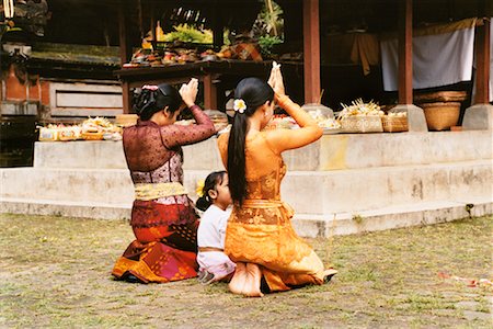 Women and Girl Praying at Temple Penestanan, Bali, Indonesia Stock Photo - Rights-Managed, Code: 700-00364294