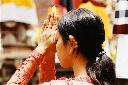 Girl Praying In Temple Penestanan, Bali, Indonesia Stock Photo - Rights-Managed, Code: 700-00364293