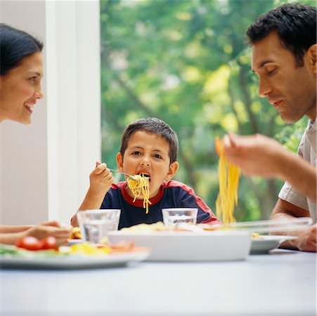simsearch:700-00364230,k - Family Eating Spaghetti Stock Photo - Rights-Managed, Code: 700-00364344