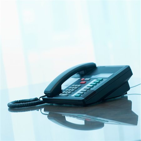 Telephone on Desk Stock Photo - Rights-Managed, Code: 700-00364352