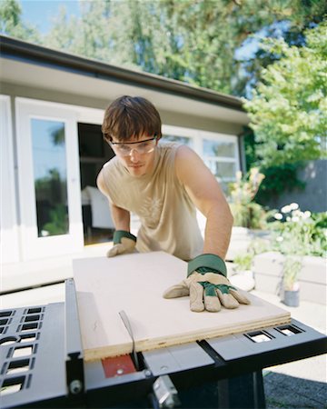 simsearch:700-00918582,k - Man Cutting Wood Stock Photo - Rights-Managed, Code: 700-00366064
