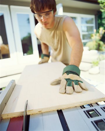 simsearch:700-00918582,k - Man Cutting Wood Stock Photo - Rights-Managed, Code: 700-00366065