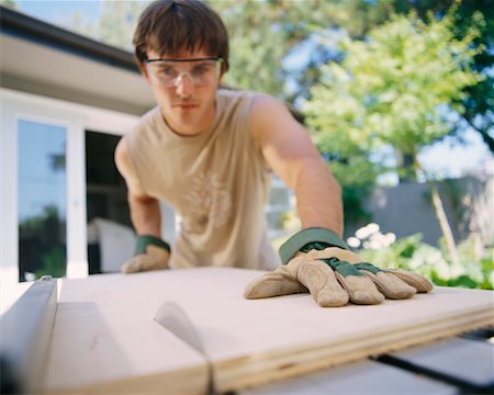 simsearch:700-00918582,k - Man Cutting Wood Stock Photo - Rights-Managed, Code: 700-00366067