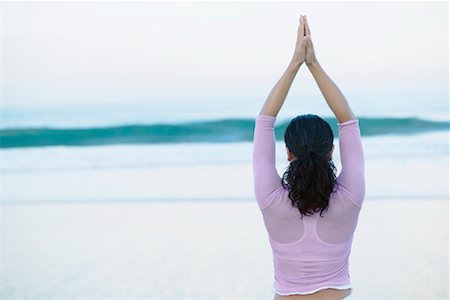 Woman Doing Yoga on Beach Stock Photo - Rights-Managed, Code: 700-00366171
