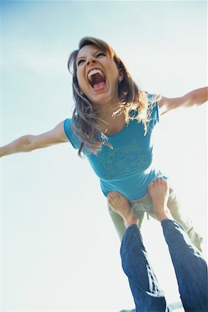 Woman Balancing on Man's Feet Stock Photo - Rights-Managed, Code: 700-00367427