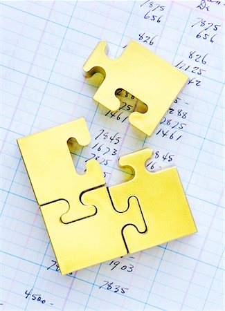 Puzzle Pieces on Ledger Stock Photo - Rights-Managed, Code: 700-00367739