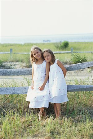 Girls by Wooden Fence Stock Photo - Rights-Managed, Code: 700-00367921