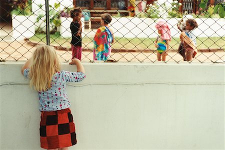 sad african children - Girl Watching Children Play Stock Photo - Rights-Managed, Code: 700-00361279