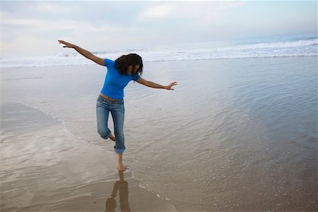 simsearch:700-00377960,k - Woman Standing on One Leg on Beach Stock Photo - Rights-Managed, Code: 700-00377964
