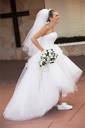 running shoes for brides - Bride Wearing Running Shoes Stock Photo - Rights-Managed, Code: 700-00371277