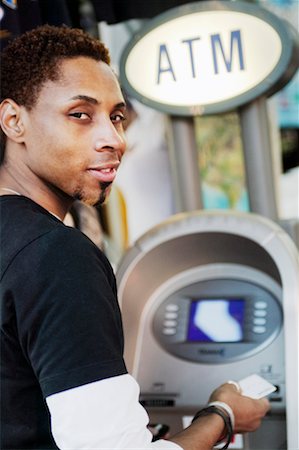 Man Using Banking Machine Stock Photo - Rights-Managed, Code: 700-00371707