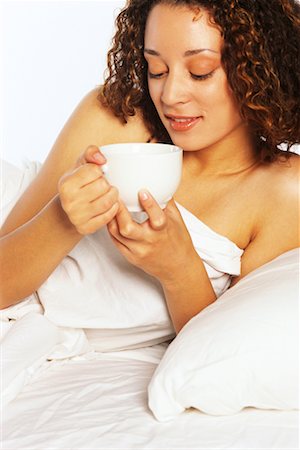 simsearch:700-00606802,k - Woman in Bed, Holding Beverage Stock Photo - Rights-Managed, Code: 700-00403929