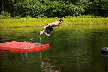 simsearch:700-00611099,k - Man Jumping in Lake Stock Photo - Rights-Managed, Code: 700-00424563