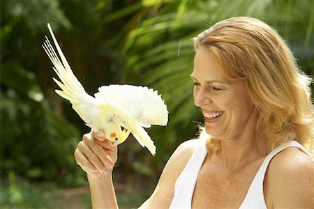 Woman Looking at Bird Stock Photo - Rights-Managed, Code: 700-00424799