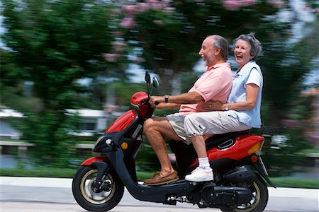 simsearch:700-00194002,k - Couple Riding Scooter Stock Photo - Rights-Managed, Code: 700-00425124