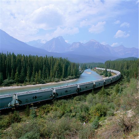 Train by River and Mountains, Banff National Park, Alberta, Canada Stock Photo - Rights-Managed, Code: 700-00425172