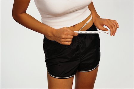 simsearch:700-01200269,k - Woman Measuring Waist Foto de stock - Con derechos protegidos, Código: 700-00425749