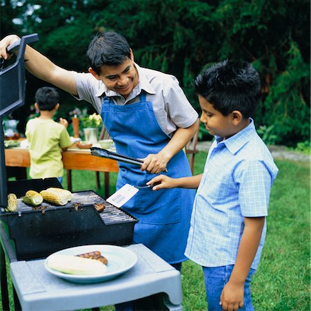 simsearch:846-02793585,k - Father Cooking on Barbeque with Son Stock Photo - Rights-Managed, Code: 700-00425975