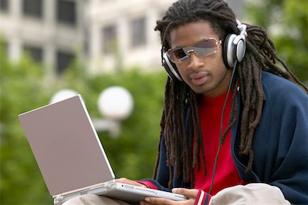 simsearch:700-06701841,k - Man with Headphones and Laptop Computer Stock Photo - Rights-Managed, Code: 700-00429826