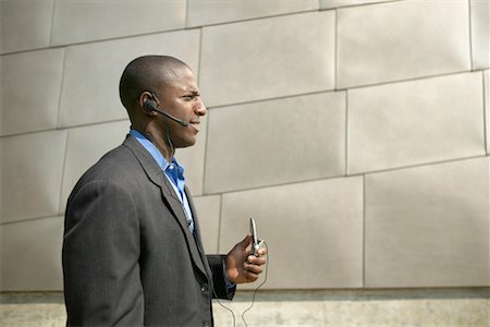 simsearch:700-00281308,k - Businessman Using Cellular Phone with Headset Stock Photo - Rights-Managed, Code: 700-00429894