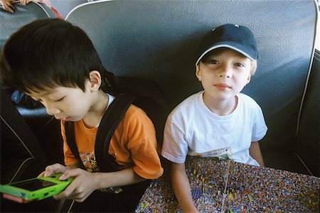 Boys Sitting on School Bus Stock Photo - Rights-Managed, Code: 700-00438962