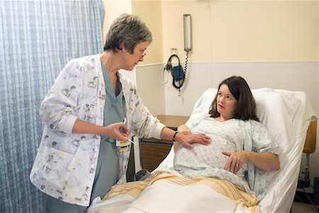Nurse Checking on Pregnant Woman Stock Photo - Rights-Managed, Code: 700-00439276