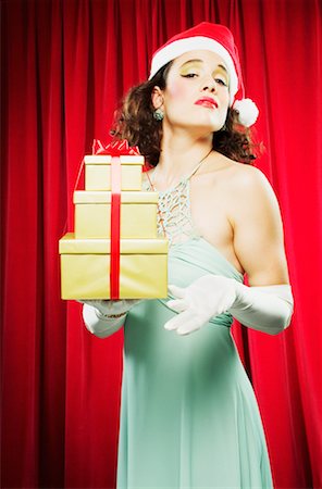 simsearch:700-00795365,k - Woman in Santa Hat Holding Gifts Stock Photo - Rights-Managed, Code: 700-00439502