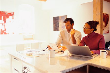 simsearch:700-00609233,k - Couple Doing Computer Banking in Kitchen Stock Photo - Rights-Managed, Code: 700-00439985