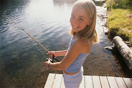 Girl Fishing Foto de stock - Con derechos protegidos, Código: 700-00430160