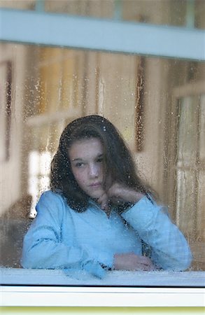 sad girls looking to window - Girl Sitting at Window Stock Photo - Rights-Managed, Code: 700-00430733