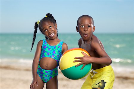 Boy and Girl Playing on Beach Stock Photo - Rights-Managed, Code: 700-00430896