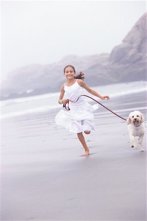 Girl Running with Dog Stock Photo - Rights-Managed, Code: 700-00458063