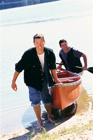 Men Pulling Canoe to Shore Stock Photo - Rights-Managed, Code: 700-00459791
