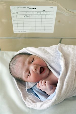 simsearch:700-00554038,k - Newborn Baby Yawning in Bassinet Stock Photo - Rights-Managed, Code: 700-00452668