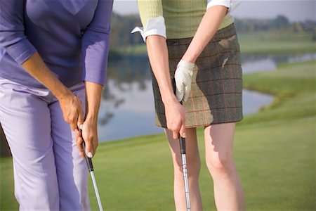 Two Women Putting Stock Photo - Rights-Managed, Code: 700-00453126