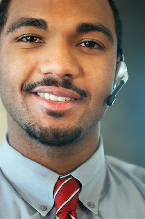 simsearch:700-01248091,k - Businessman with Telephone Headset Stock Photo - Rights-Managed, Code: 700-00477335