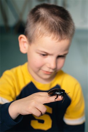 simsearch:700-00477662,k - Child Holding Giant Cockroach Stock Photo - Rights-Managed, Code: 700-00477669