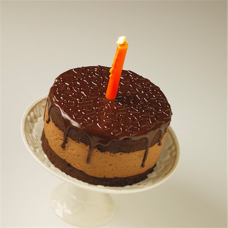 simsearch:600-02461257,k - Chocolate Mousse Cake with Candle Stock Photo - Rights-Managed, Code: 700-00477709