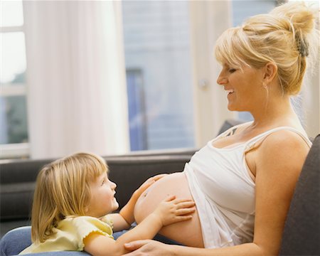 simsearch:700-00557270,k - Girl Feeling Pregnant Mothers Stomach Stock Photo - Rights-Managed, Code: 700-00478244