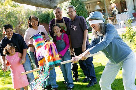 Family Playing with Pinata in Backyard Stock Photo - Rights-Managed, Code: 700-00481630