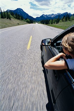 simsearch:700-00089787,k - Woman Sticking Head and Arm out of Car Window Stock Photo - Rights-Managed, Code: 700-00481687