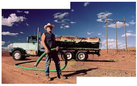 Oil Worker with Tanker and Hose Stock Photo - Rights-Managed, Code: 700-00514239