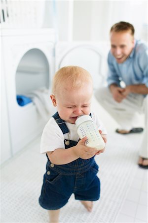 sulky tantrum - Child Crying, In Laundry Room With Father Stock Photo - Rights-Managed, Code: 700-00514353